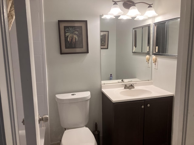 bathroom featuring vanity and toilet