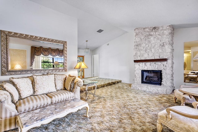 living room with vaulted ceiling, carpet flooring, and a fireplace