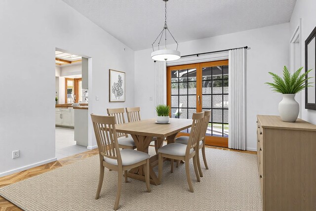 carpeted spare room with lofted ceiling, a notable chandelier, and a textured ceiling