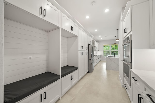 mudroom featuring light tile patterned floors