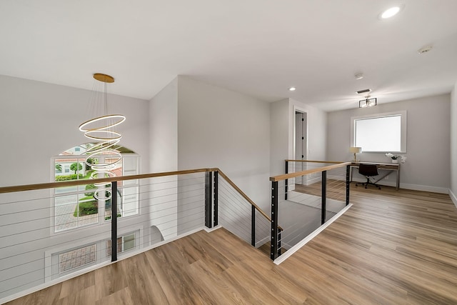 hall with light hardwood / wood-style flooring