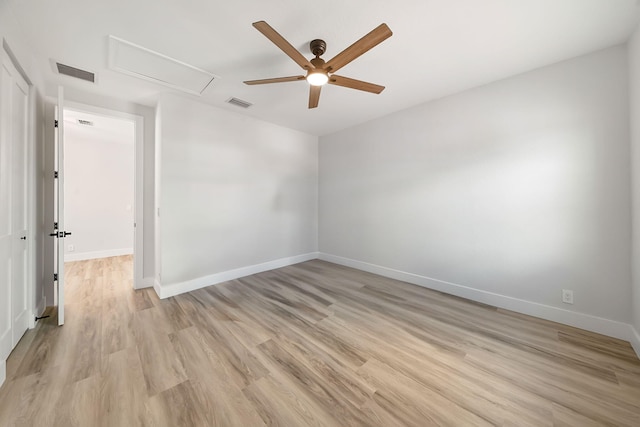 spare room with ceiling fan and light hardwood / wood-style floors