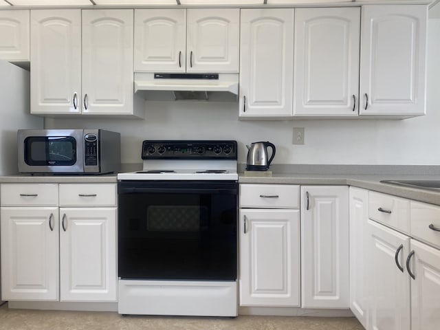 kitchen with white cabinetry and electric range