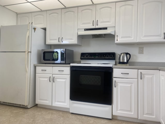 kitchen featuring white cabinets, light tile patterned floors, and white appliances