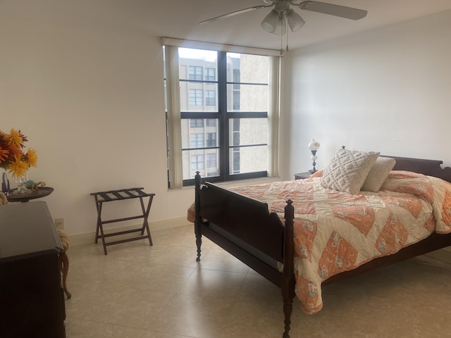 bedroom with multiple windows and ceiling fan