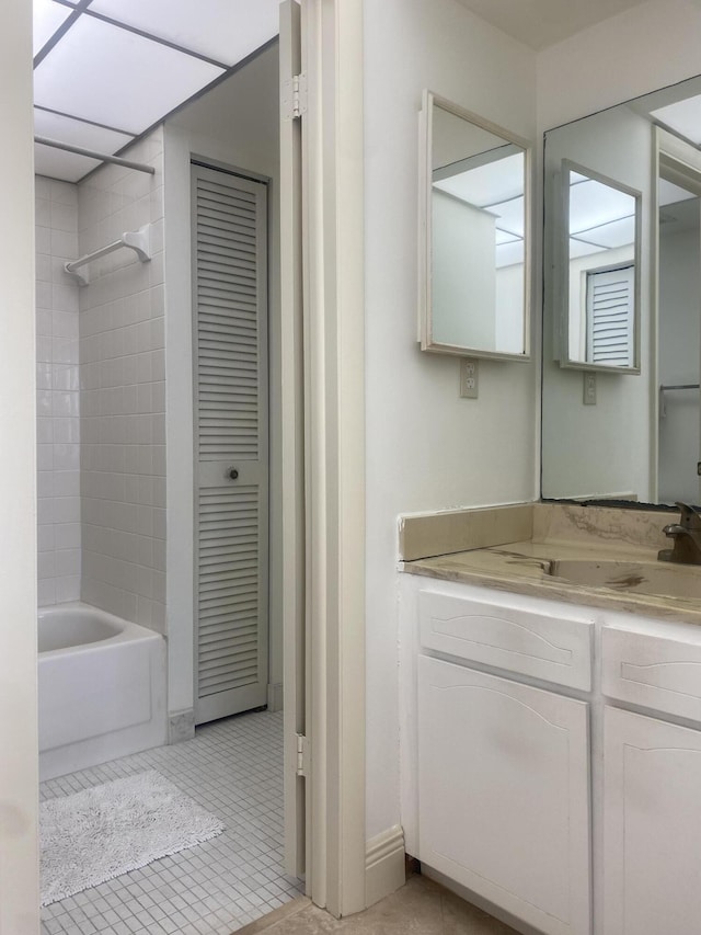 bathroom with vanity, shower / bath combination, and tile patterned floors