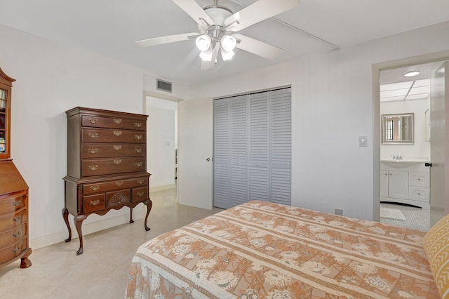 bedroom featuring sink, ensuite bath, a closet, and ceiling fan