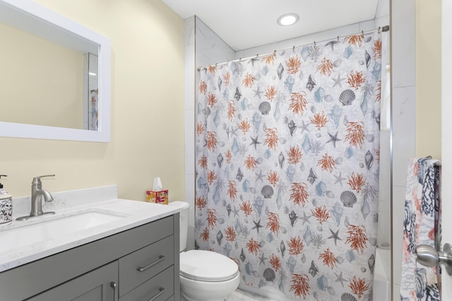 bathroom featuring vanity, toilet, and a shower with shower curtain