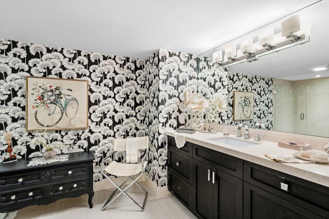 bathroom with vanity and a shower with shower door