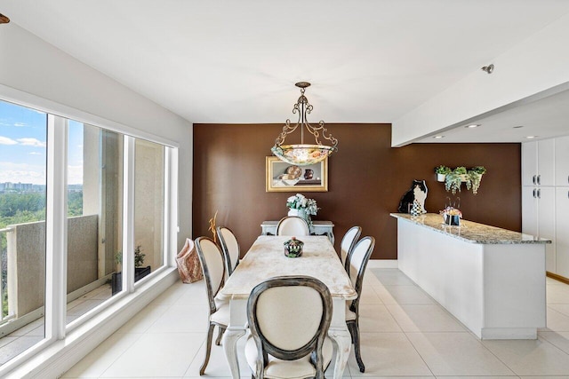 dining area with light tile patterned floors