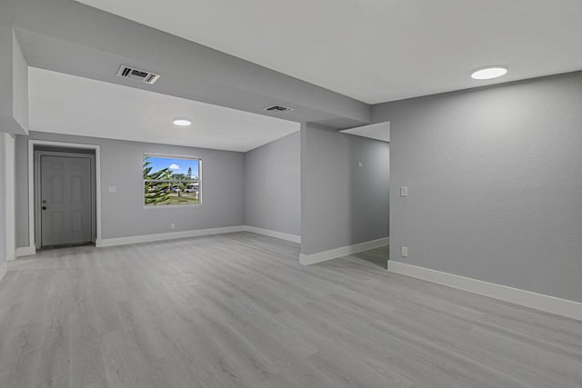 unfurnished room featuring light hardwood / wood-style floors