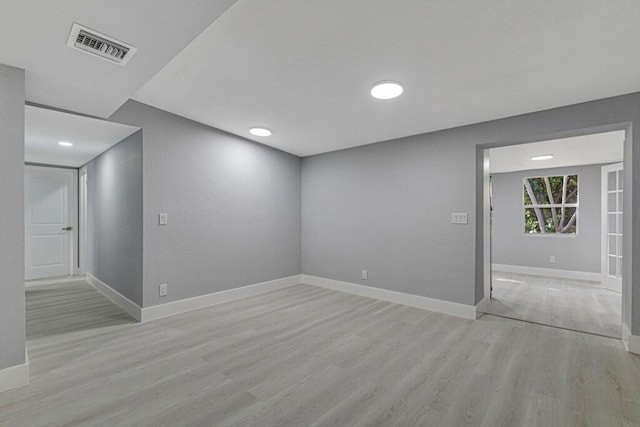 unfurnished room with light hardwood / wood-style floors