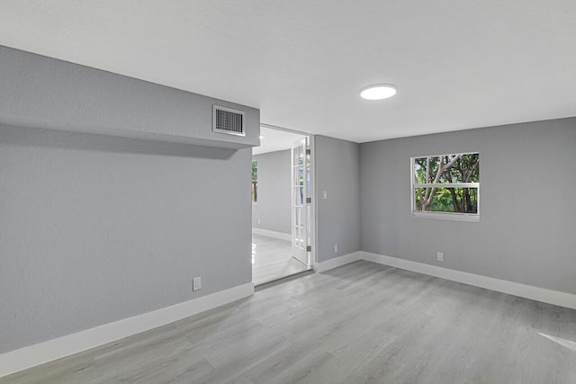 basement featuring light hardwood / wood-style floors