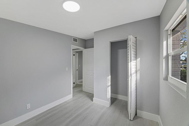 unfurnished bedroom featuring light hardwood / wood-style floors