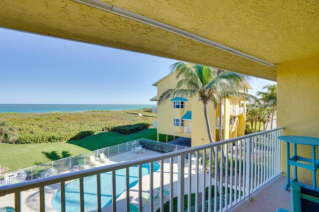 balcony featuring a water view