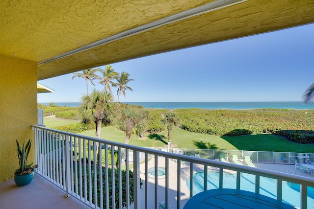 balcony featuring a water view