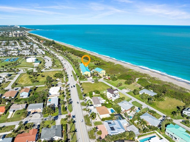 bird's eye view with a beach view and a water view