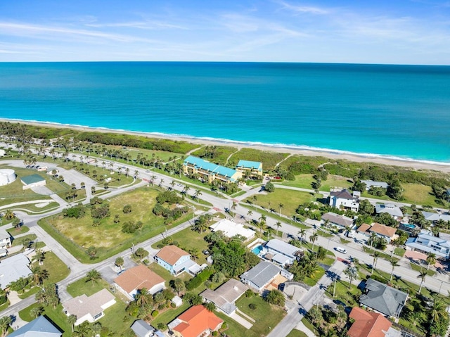 aerial view featuring a water view and a beach view