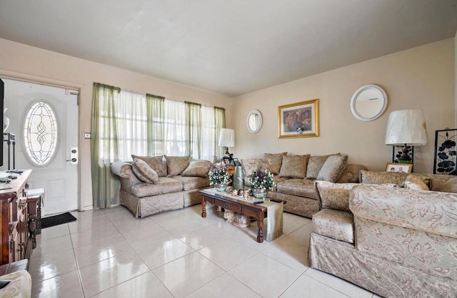 living room with light tile patterned flooring and a healthy amount of sunlight