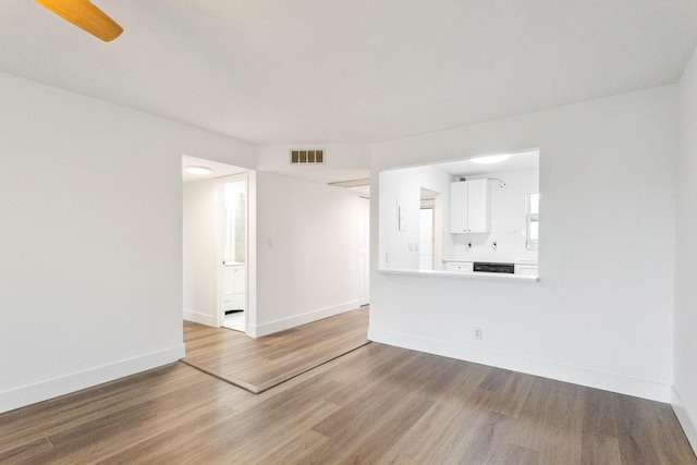 unfurnished living room with hardwood / wood-style flooring