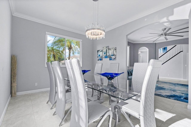 tiled dining space with ceiling fan with notable chandelier and crown molding