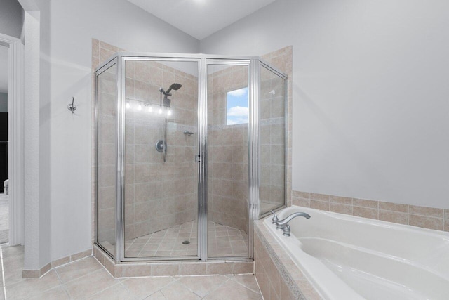 11158 Mainsail Ct, Wellington, FL 33449 - bathroom featuring a stall shower, a garden tub, lofted ceiling, and tile patterned floors