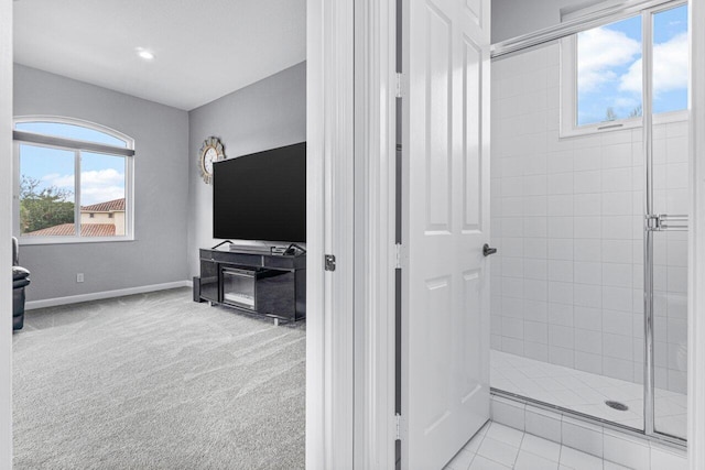 bathroom with a tile shower