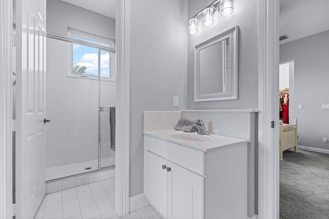 bathroom with vanity, tile patterned floors, and walk in shower