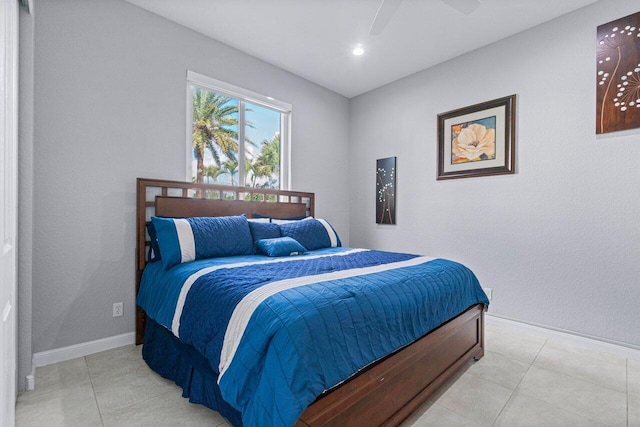11158 Mainsail Ct, Wellington, FL 33449 - bedroom with light tile patterned floors, baseboards, and a ceiling fan