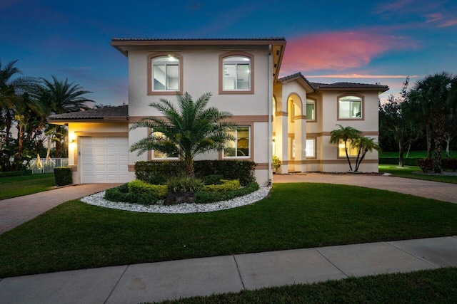 11158 Mainsail Ct, Wellington, FL 33449 - mediterranean / spanish home featuring decorative driveway, stucco siding, a tiled roof, and a yard