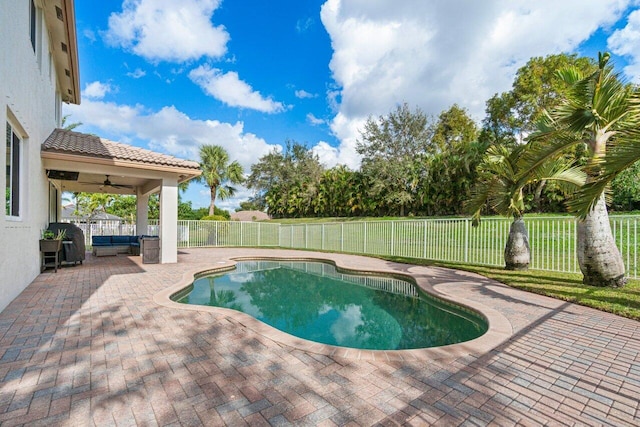 view of pool with a patio area, ceiling fan, and an outdoor hangout area