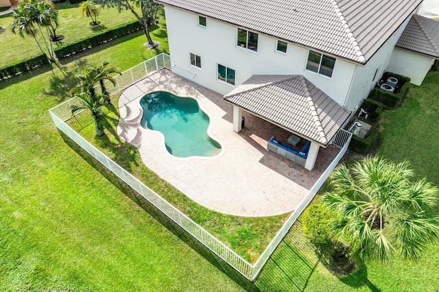 view of swimming pool featuring a lawn and a patio area