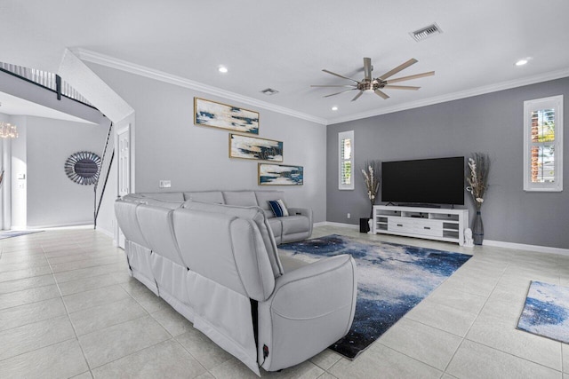 living room featuring light tile patterned flooring, ceiling fan with notable chandelier, and ornamental molding