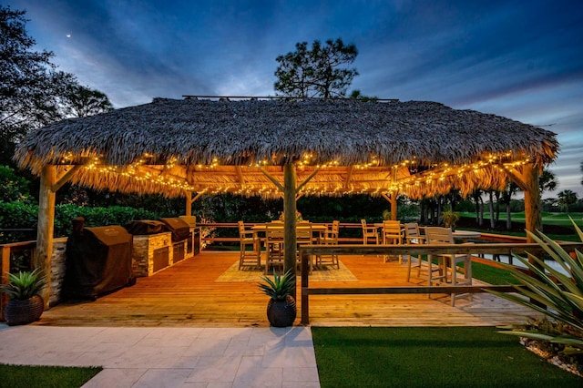 surrounding community featuring a gazebo and a wooden deck