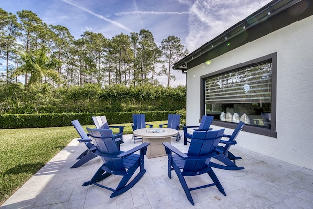 view of patio with an outdoor fire pit