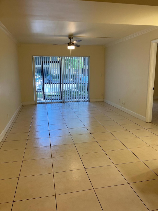 tiled empty room featuring crown molding and ceiling fan