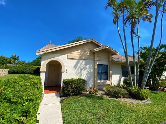 view of front of home with a front yard