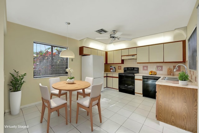 kitchen featuring ceiling fan, sink, decorative backsplash, light tile patterned flooring, and black appliances