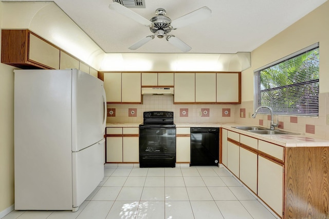 kitchen featuring tasteful backsplash, ceiling fan, sink, black appliances, and light tile patterned flooring