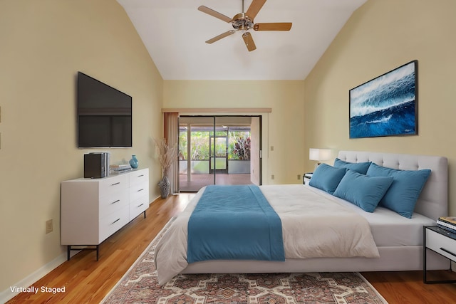 bedroom with access to exterior, ceiling fan, light hardwood / wood-style flooring, and vaulted ceiling