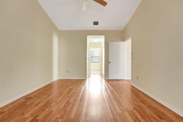 spare room featuring ceiling fan and light wood-type flooring