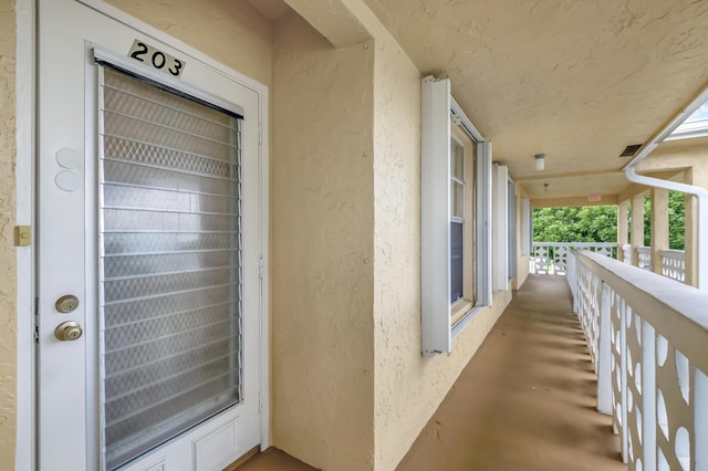 view of exterior entry with a porch