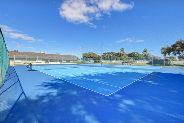 view of sport court featuring basketball hoop