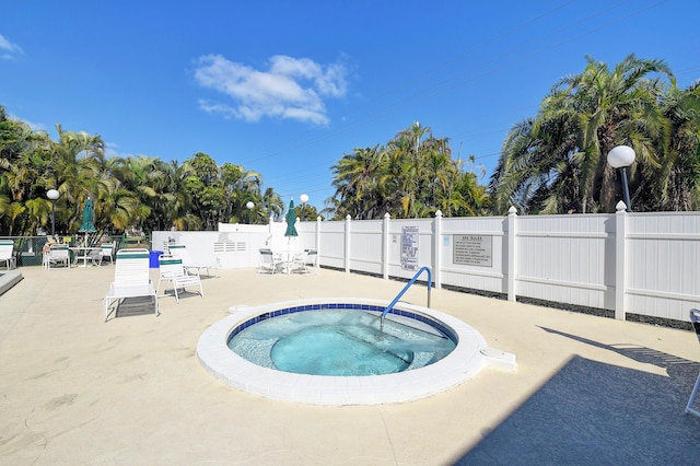 view of pool featuring a patio area and a community hot tub