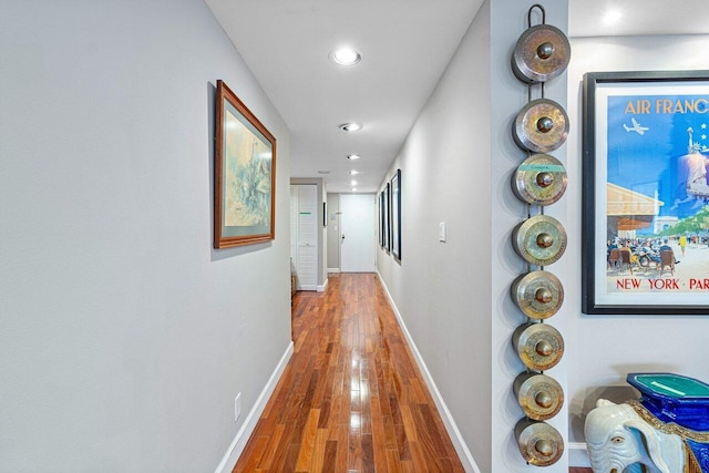 corridor featuring wood-type flooring