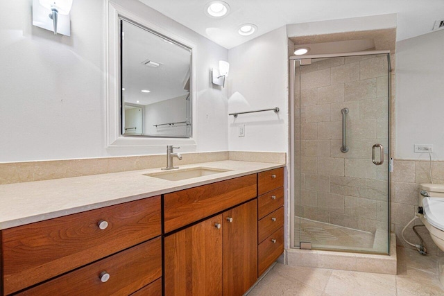 bathroom featuring tile patterned flooring, an enclosed shower, toilet, vanity, and tile walls