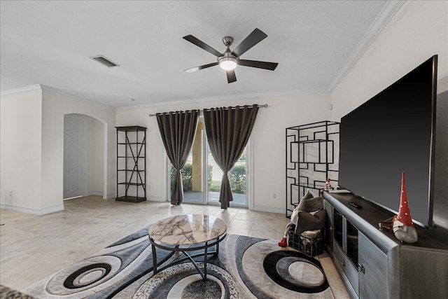 sitting room with crown molding, light tile patterned flooring, and ceiling fan