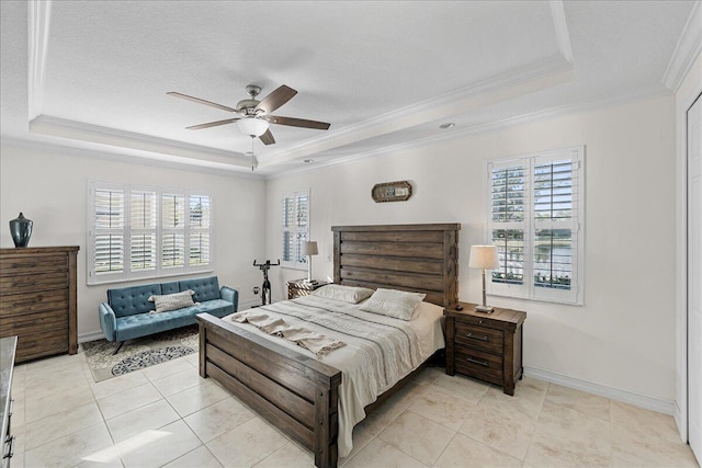 bedroom with light tile patterned floors, a raised ceiling, ceiling fan, and ornamental molding