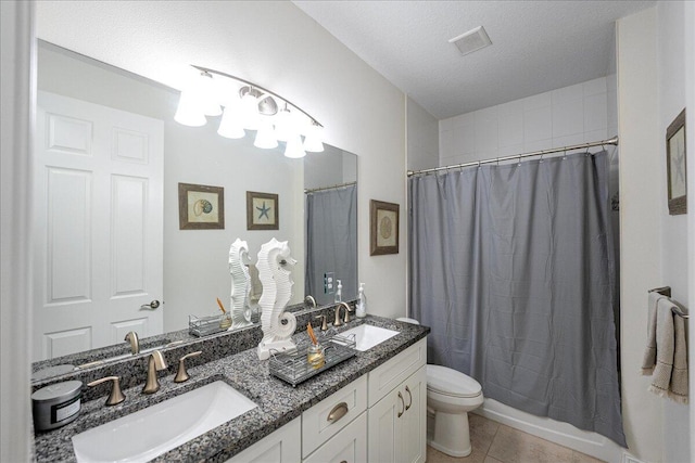 full bathroom featuring shower / tub combo, tile patterned floors, vanity, a textured ceiling, and toilet