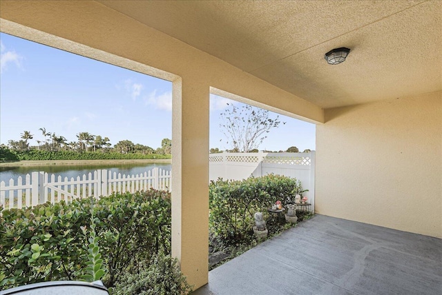 view of patio / terrace with a water view